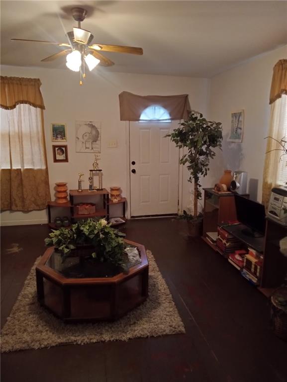 482022 Dauphine St, New Orleans, LA 70117 - foyer with ceiling fan and wood finished floors
