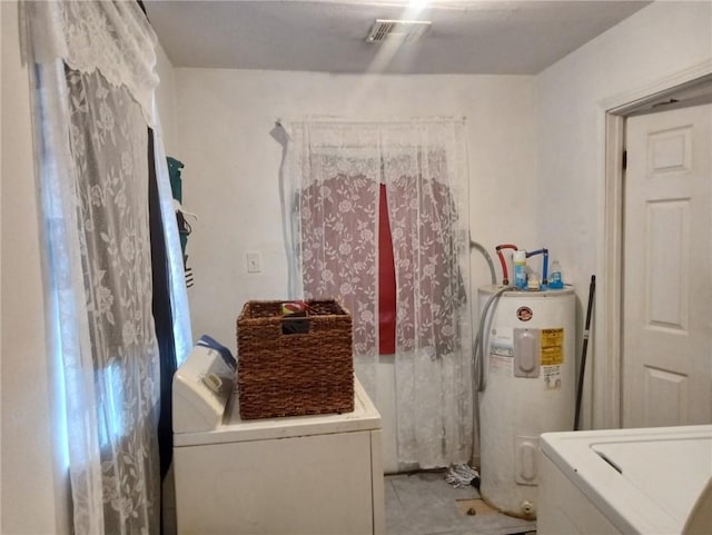 482022 Dauphine St, New Orleans, LA 70117 - washroom featuring washer / clothes dryer, electric water heater, and light tile patterned floors
