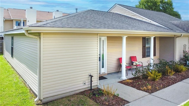 1700 Marseille Dr Unit 16, La Place, LA 70068 - view of front facade featuring a shingled roof and a porch