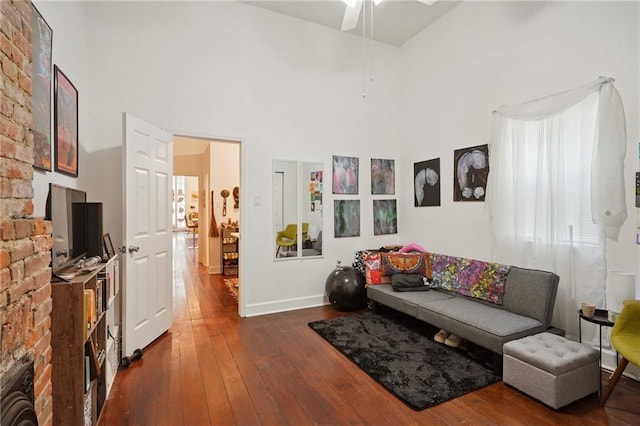 232830 Bienville St, New Orleans, LA 70119 - living area featuring a towering ceiling, dark wood-style floors, and ceiling fan