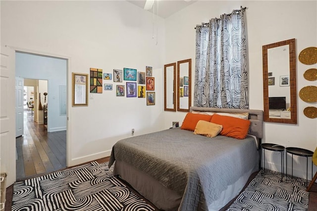 232830 Bienville St, New Orleans, LA 70119 - bedroom with hardwood / wood-style flooring, a towering ceiling, and ceiling fan