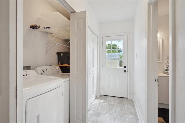 232830 Bienville St, New Orleans, LA 70119 - laundry area featuring separate washer and dryer and light marble finish flooring