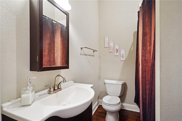 232830 Bienville St, New Orleans, LA 70119 - full bathroom with wood finished floors and vanity