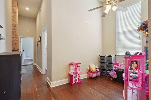 232830 Bienville St, New Orleans, LA 70119 - game room with hardwood / wood-style floors, a ceiling fan, healthy amount of natural light, and a towering ceiling