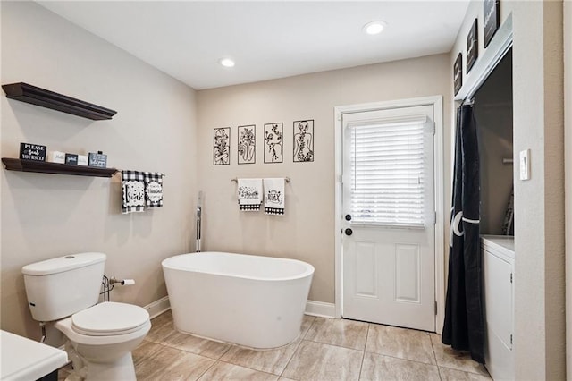 232830 Bienville St, New Orleans, LA 70119 - full bath featuring a freestanding bath, vanity, recessed lighting, and tile patterned flooring