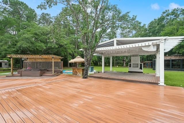 107 Quail St, Slidell, LA 70460 - deck featuring a gazebo, a pergola, a yard, and view of scattered trees