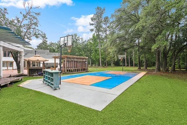107 Quail St, Slidell, LA 70460 - view of sport court with basketball court and a yard