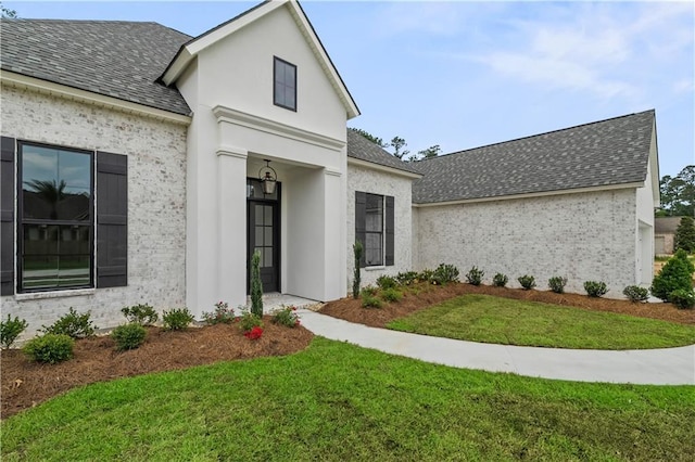 1337 Avenue Lacroix Ave, Lacroix, Covington, LA 70433 - view of front of house with roof with shingles, a front yard, and stucco siding