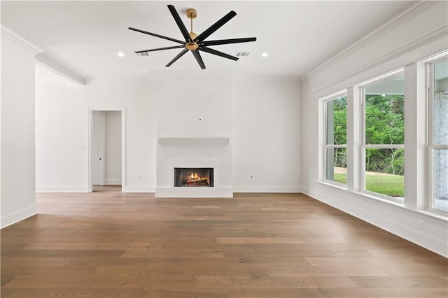 1337 Avenue Lacroix Ave, Lacroix, Covington, LA 70433 - unfurnished living room featuring ornamental molding, a warm lit fireplace, recessed lighting, wood finished floors, and a ceiling fan