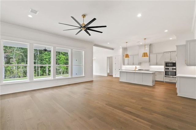 1337 Avenue Lacroix Ave, Lacroix, Covington, LA 70433 - unfurnished living room with ceiling fan, wood finished floors, crown molding, and recessed lighting
