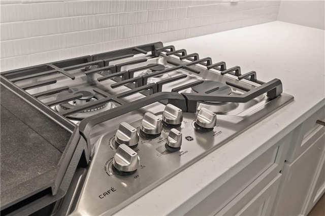 1337 Avenue Lacroix Ave, Lacroix, Covington, LA 70433 - kitchen view of stainless steel gas cooktop and tasteful backsplash