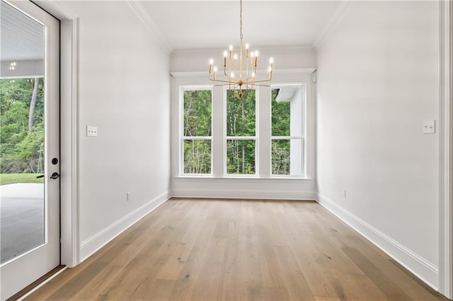 1337 Avenue Lacroix Ave, Lacroix, Covington, LA 70433 - unfurnished dining area featuring a chandelier, crown molding, and light wood-style floors