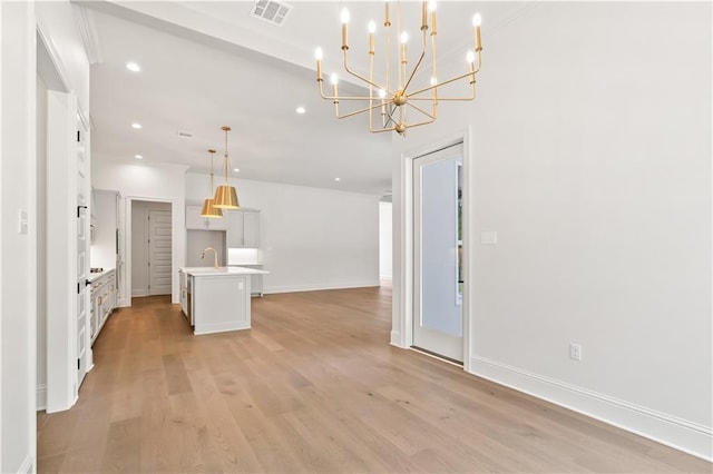 1337 Avenue Lacroix Ave, Lacroix, Covington, LA 70433 - unfurnished living room featuring recessed lighting, a chandelier, light wood-style flooring, and ornamental molding