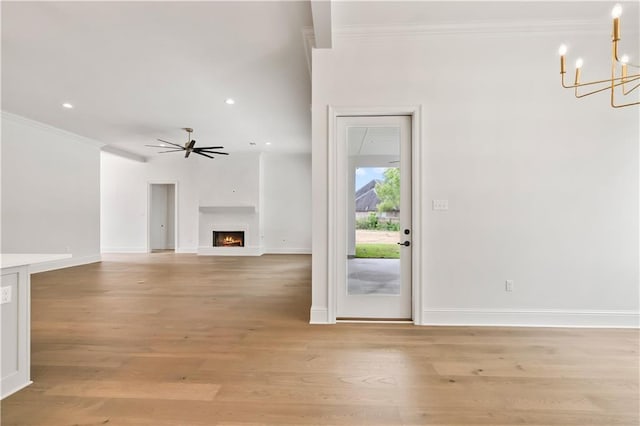 1337 Avenue Lacroix Ave, Lacroix, Covington, LA 70433 - unfurnished living room with ornamental molding, a chandelier, light wood-style floors, a warm lit fireplace, and ceiling fan