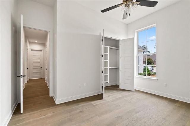 1337 Avenue Lacroix Ave, Lacroix, Covington, LA 70433 - unfurnished bedroom featuring light wood finished floors, a spacious closet, and ceiling fan
