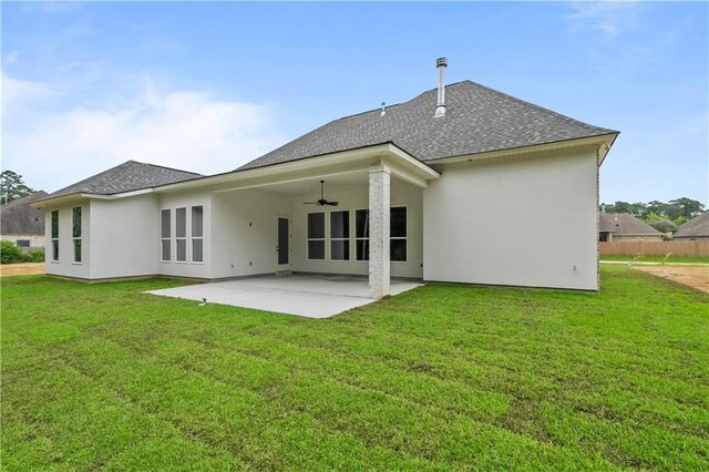 1337 Avenue Lacroix Ave, Lacroix, Covington, LA 70433 - rear view of house featuring a shingled roof, ceiling fan, a patio area, and a yard