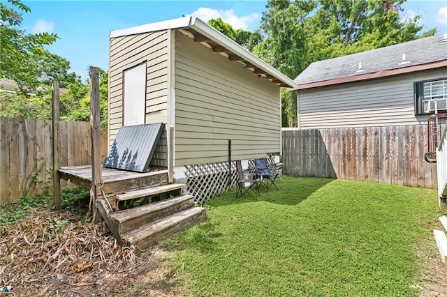 4110 Hollygrove St, New Orleans, LA 70118 - view of home's exterior featuring a fenced backyard and a storage unit