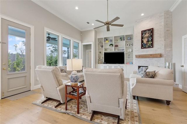 1193 Delta Ln, Covington, LA 70433 - living room with plenty of natural light, a ceiling fan, ornamental molding, light wood finished floors, and recessed lighting