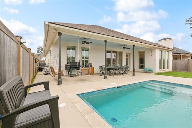 1193 Delta Ln, Covington, LA 70433 - back of property featuring ceiling fan, a fenced backyard, outdoor dining area, and a patio