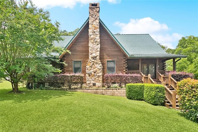 75581 N Hayes Rd, Kentwood, LA 70444 - back of house featuring log siding, a chimney, a yard, and french doors