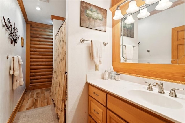 75581 N Hayes Rd, Kentwood, LA 70444 - bathroom with vanity, wood finished floors, and a shower with shower curtain