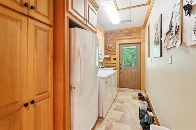 75581 N Hayes Rd, Kentwood, LA 70444 - laundry room featuring cabinet space, washing machine and clothes dryer, and light stone finish floors
