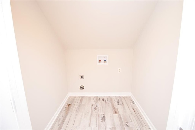 1304 Madewood Rd, La Place, LA 70068 - laundry area featuring hookup for an electric dryer, washer hookup, and light wood finished floors