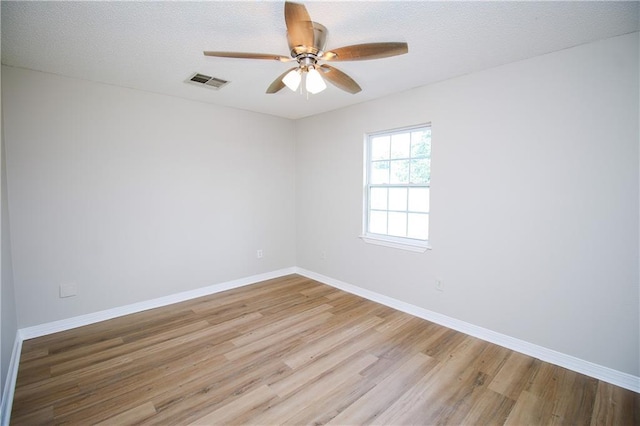 1304 Madewood Rd, La Place, LA 70068 - unfurnished room featuring wood finished floors, a ceiling fan, and a textured ceiling
