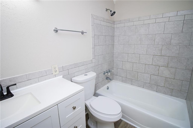 1304 Madewood Rd, La Place, LA 70068 - bathroom featuring tile walls, shower / washtub combination, and vanity
