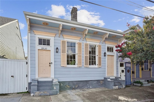 1529 St Philip St, New Orleans, LA 70116 - view of front of property featuring entry steps and a chimney