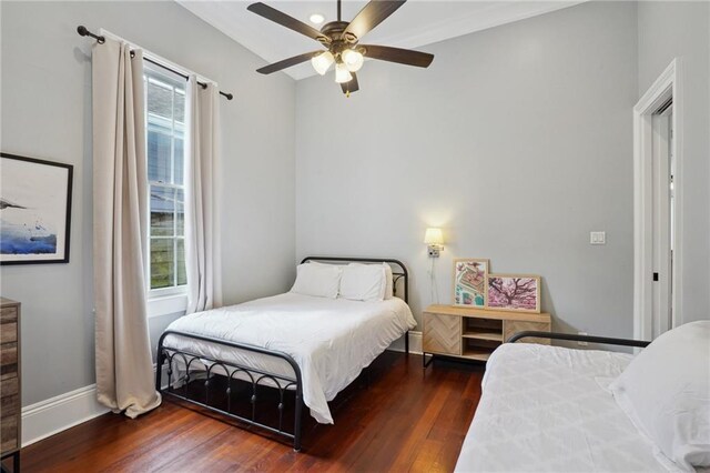 1529 St Philip St, New Orleans, LA 70116 - bedroom with wood finished floors and a ceiling fan