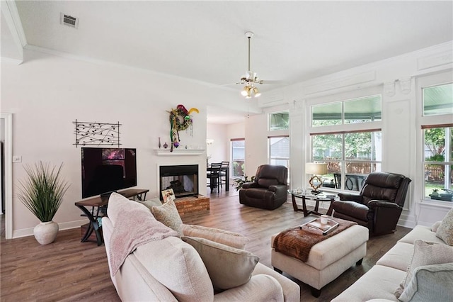 67061 Dolan St, Mandeville, LA 70471 - living room with wood finished floors and a glass covered fireplace