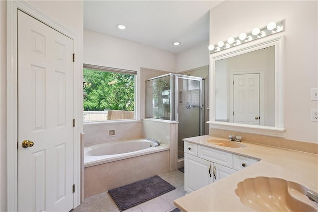 67061 Dolan St, Mandeville, LA 70471 - full bath featuring a shower stall, a bath, vanity, tile patterned floors, and recessed lighting