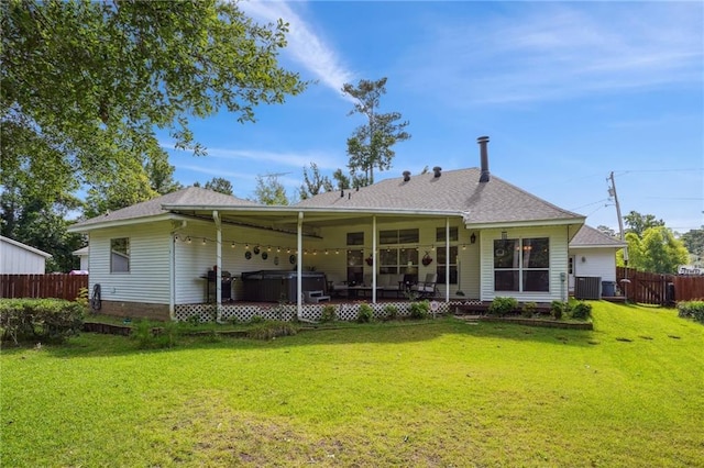 67061 Dolan St, Mandeville, LA 70471 - back of property with a hot tub and a shingled roof