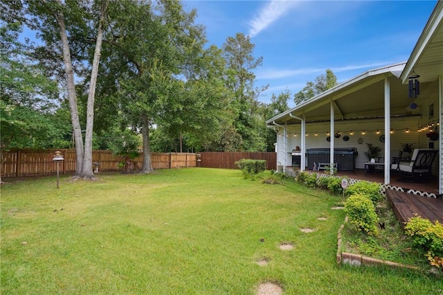 67061 Dolan St, Mandeville, LA 70471 - fenced yard with a hot tub and a deck