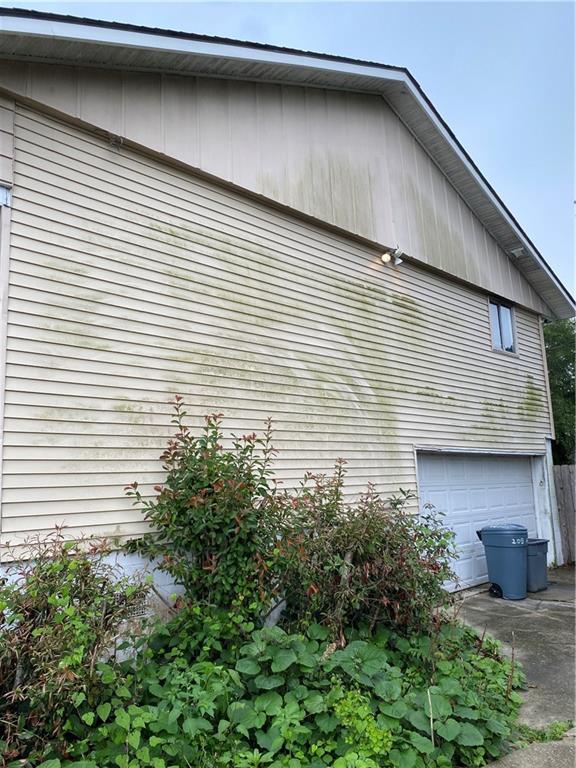 208 Amapola Cir, Terrytown, LA 70056 - view of home's exterior featuring a garage and concrete driveway