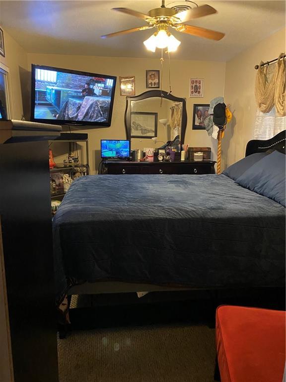 208 Amapola Cir, Terrytown, LA 70056 - carpeted bedroom featuring a ceiling fan