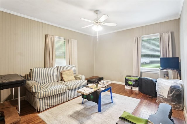 72433 Bullard St, Covington, LA 70435 - living room featuring wood-type flooring, ornamental molding, and a ceiling fan