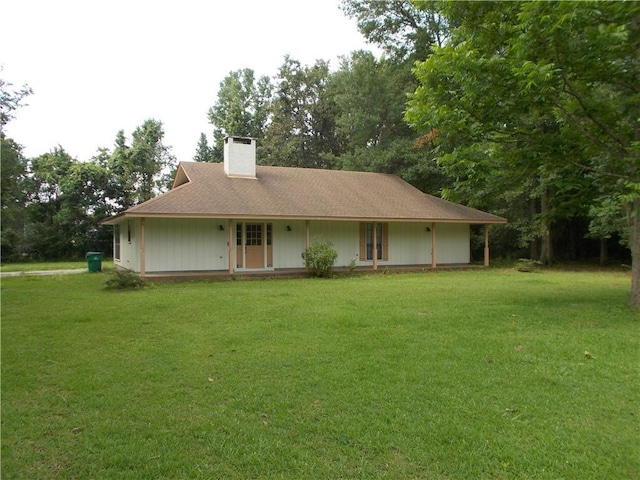 2112 Hamilton St, Franklinton, LA 70438 - view of front of home featuring a chimney, a front lawn, and view of scattered trees