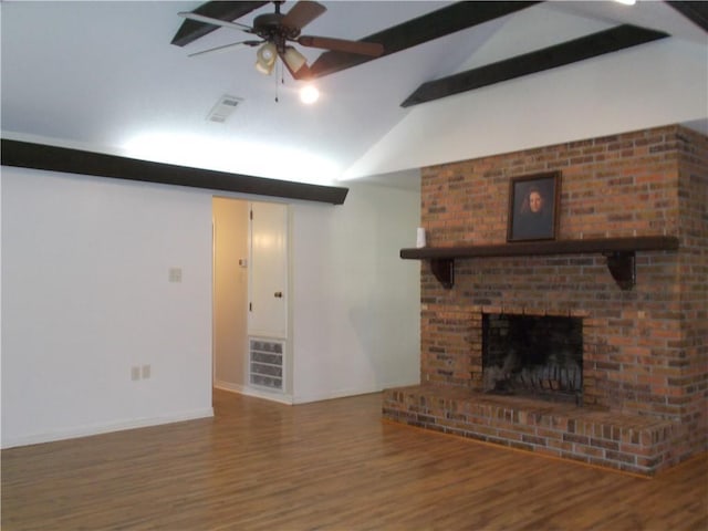 2112 Hamilton St, Franklinton, LA 70438 - unfurnished living room featuring beam ceiling, wood finished floors, a ceiling fan, a fireplace, and high vaulted ceiling