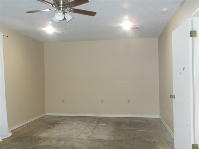 2112 Hamilton St, Franklinton, LA 70438 - spare room featuring a ceiling fan, a textured ceiling, a smoke detector, and concrete flooring