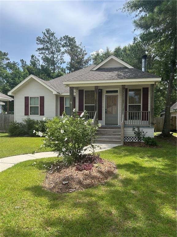 28623 Berry Todd Rd, Lacombe, LA 70445 - view of front of house with roof with shingles and covered porch