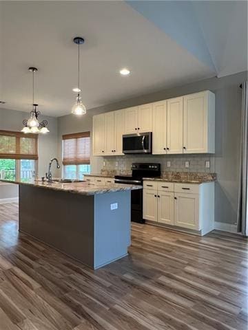 28623 Berry Todd Rd, Lacombe, LA 70445 - kitchen featuring stainless steel microwave, electric range, plenty of natural light, and dark wood-style floors