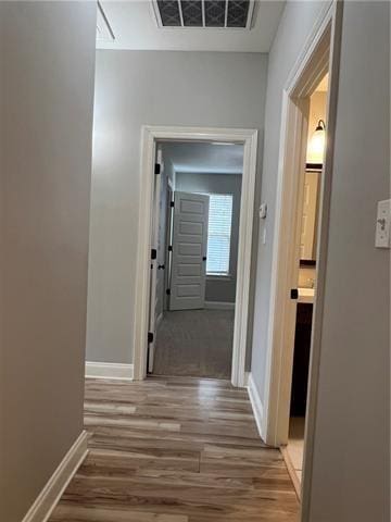 28623 Berry Todd Rd, Lacombe, LA 70445 - hallway featuring baseboards and wood finished floors