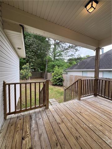 28623 Berry Todd Rd, Lacombe, LA 70445 - deck with a fenced backyard