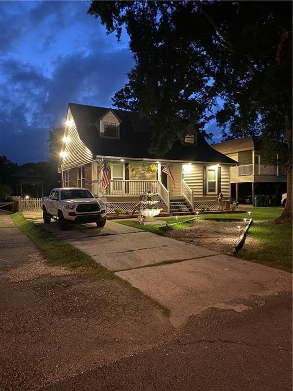 3109 Bayou View Pl, Slidell, LA 70458 - cape cod house featuring covered porch and concrete driveway