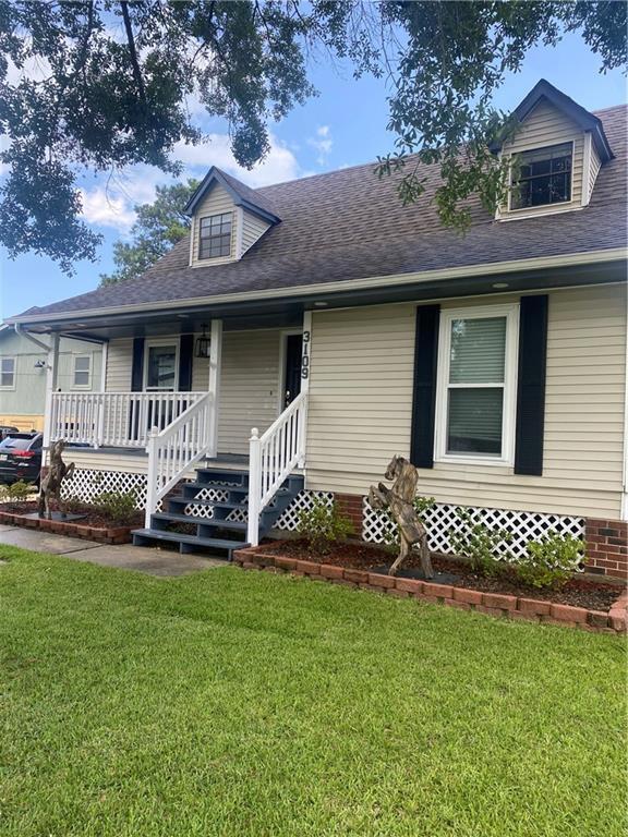 3109 Bayou View Pl, Slidell, LA 70458 - view of front of property featuring a front lawn, roof with shingles, and a porch