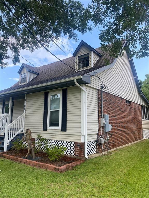 3109 Bayou View Pl, Slidell, LA 70458 - view of side of home featuring a yard and a shingled roof