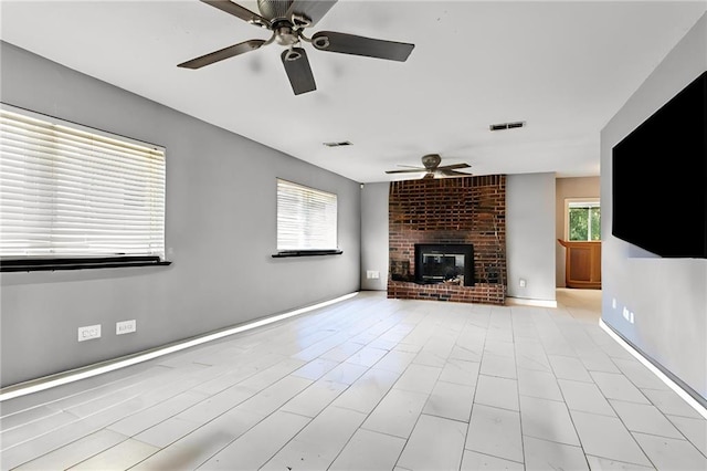 3109 Bayou View Pl, Slidell, LA 70458 - unfurnished living room with ceiling fan and a brick fireplace