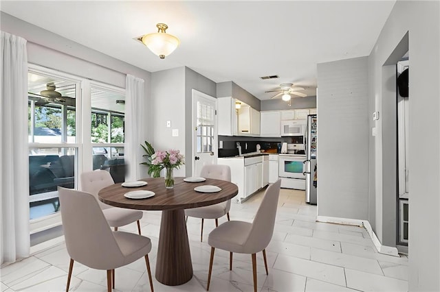 3109 Bayou View Pl, Slidell, LA 70458 - dining space with a ceiling fan and baseboards